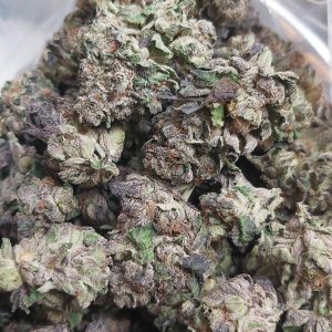 Black Candy cannabis strain featuring rich flavors, smooth effects, and premium quality smalls by QuadCo.